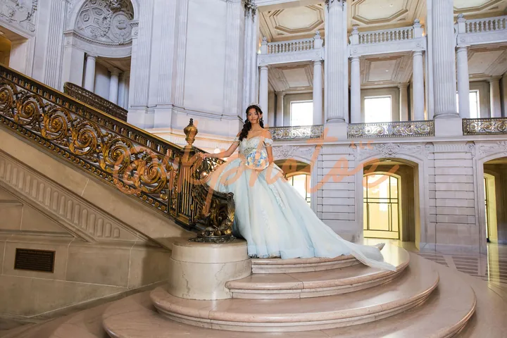 Quince portrait on the grand staircase inside San Francisco City Hall